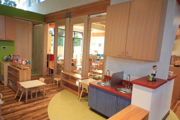 Interior view of Eyas Montessori classroom showing tables and children's wash station