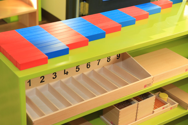 Montessori number rods activity on shelves in Eyas Montessori classroom