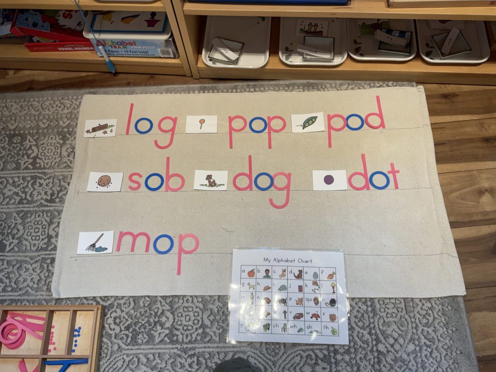 Montessori movable alphabet activity on a mat in Eyas Montessori classroom