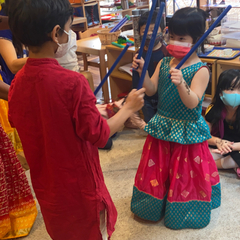 Children dancing during cultural activity at Eyas Montessori